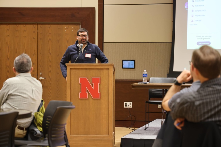 A person presents at a conference