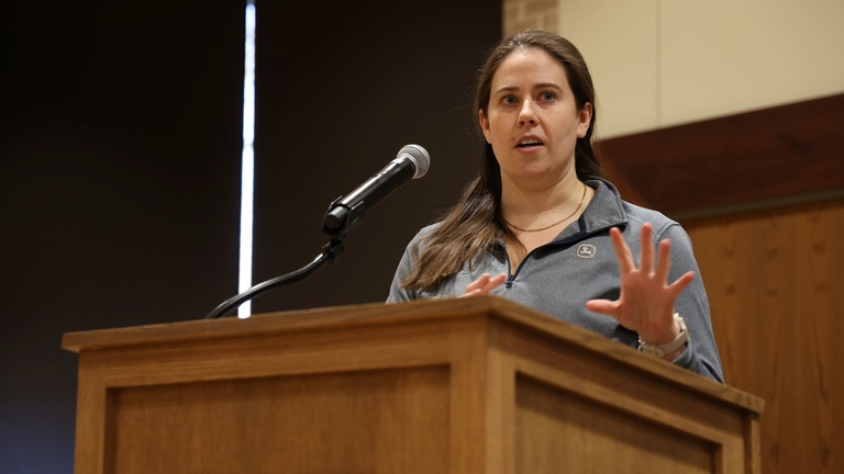 A person presenting at a conference