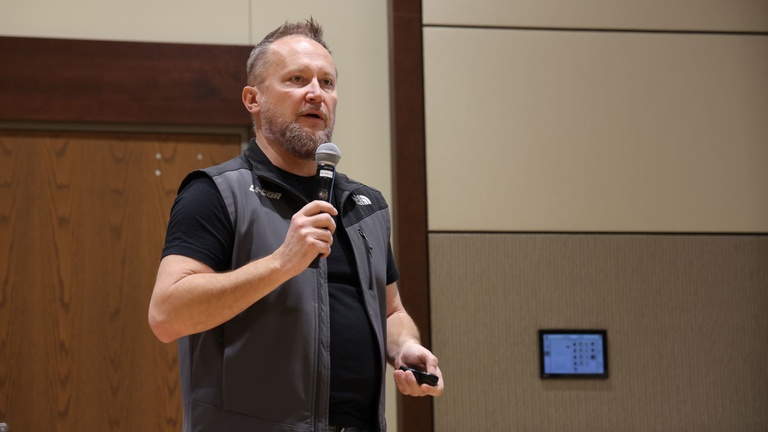 A person presenting at a conference