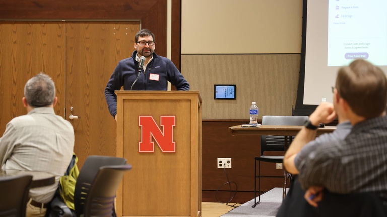 A person presents at a conference