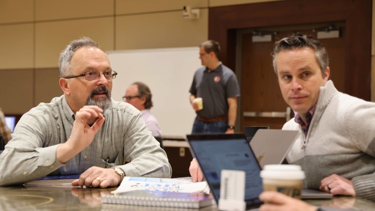 People talking at a conference