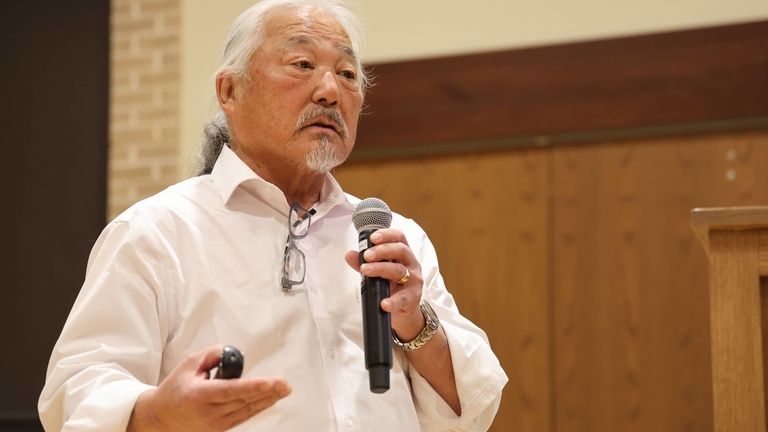 A person presenting at a conference