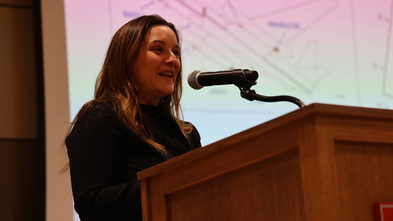 A person presenting at a conference