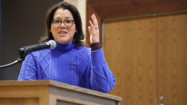 A person presenting at a conference